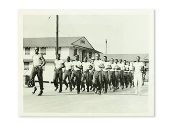 (MILITARY--WORLD WAR TWO.) Group of 13 press photographs of black in the military during WWII, including Tuskegee Airmen.